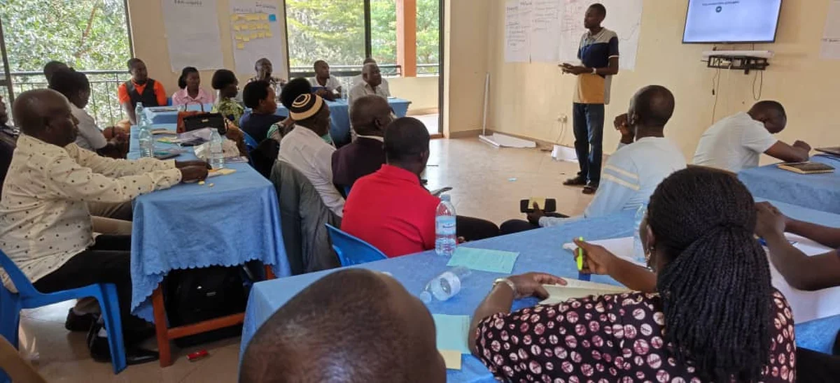 Derick Asiimwe leading a digital skills training workshop in Uganda